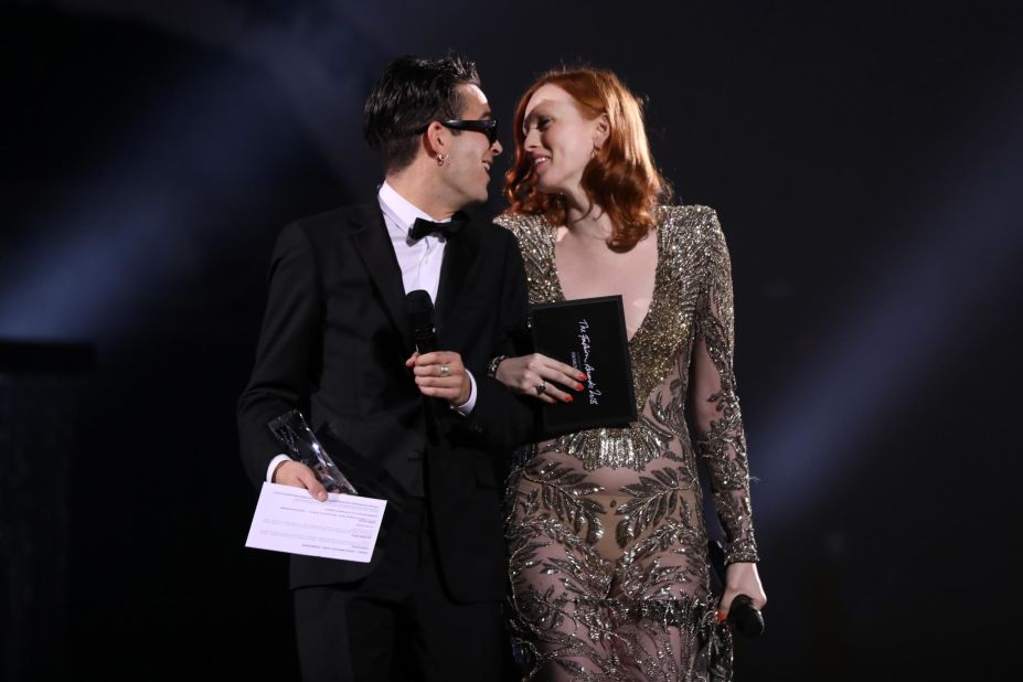 Matthew Healy and Karen Elson on stage to present the British Emerging Talent Womenswear Award during The Fashion Awards 2018. 