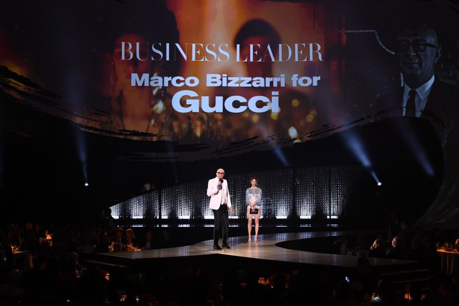 Saoirse Ronan presents the Business Leader award to Marco Bizzarri for Gucci during The Fashion Awards 2018.