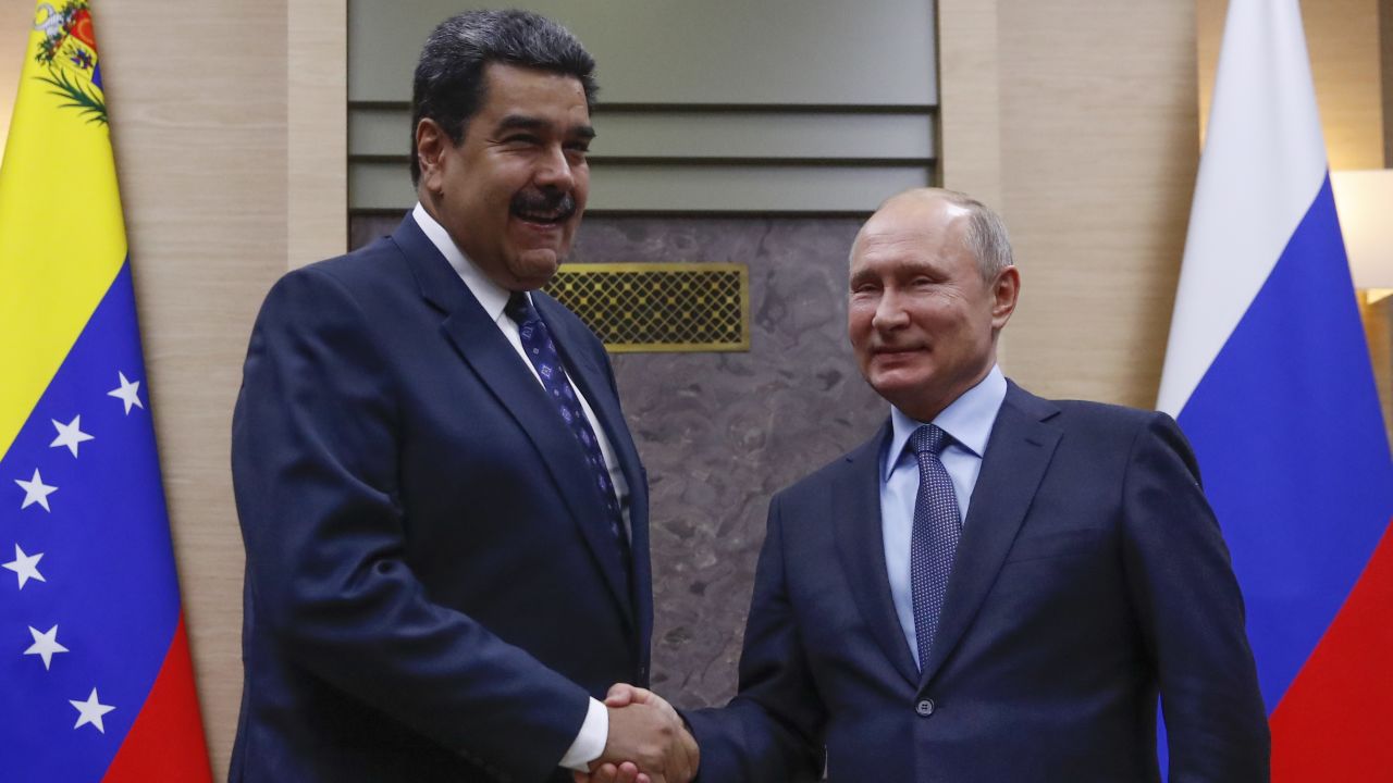 Russian President Vladimir Putin (R) shakes hands with his Venezuelan counterpart Nicolas Maduro during a meeting at the Novo-Ogaryovo state residence outside Moscow on December 5, 2018. (Photo by MAXIM SHEMETOV / POOL / AFP)        (Photo credit should read MAXIM SHEMETOV/AFP/Getty Images)