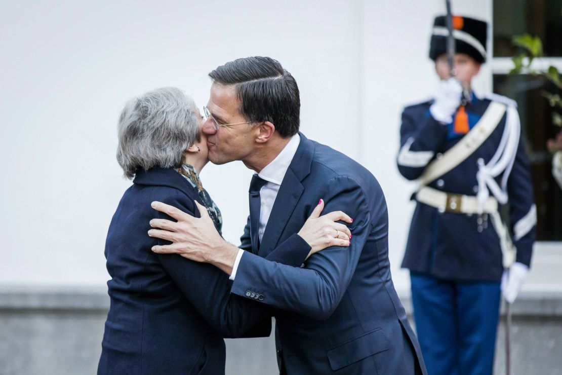 Dutch Prime Minister Mark Rutte (R) welcomes Theresa May for a work breakfast in The Hague, on December 11, 2018