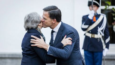 Dutch Prime Minister Mark Rutte (R) welcomes Theresa May for a work breakfast in The Hague, on December 11, 2018