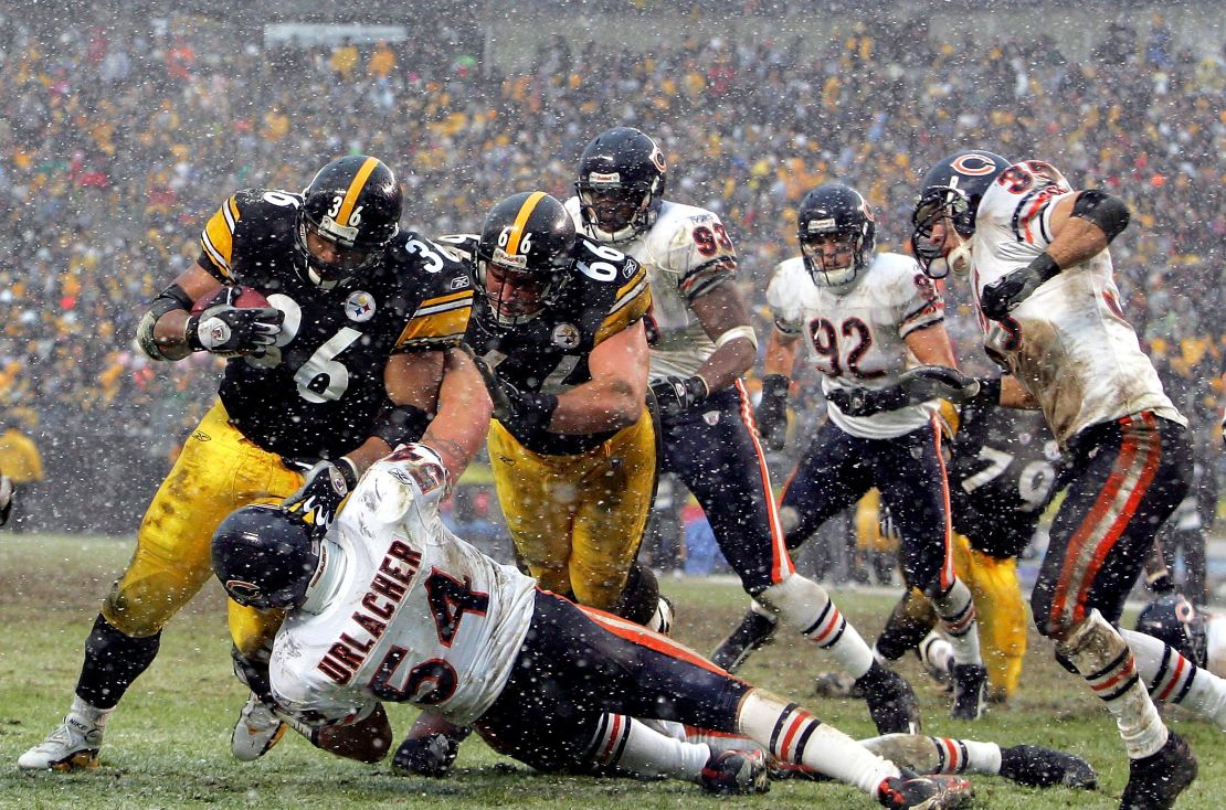 Jerome Bettis of the Pittsburgh Steelers runs over Brian Urlacher of the Chicago Bears for a touchdown on December 11, 2005. The win over the Bears was the first of eight straight for the eventual Super Bowl champions. 