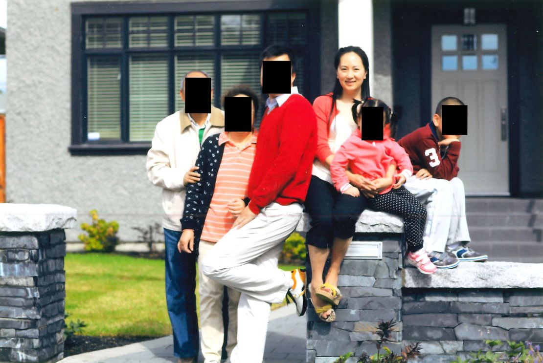 Meng Wanzhou with her husband, her in-laws and her two children, according to court documents. The faces of the other family members have been redacted to protect their identities.