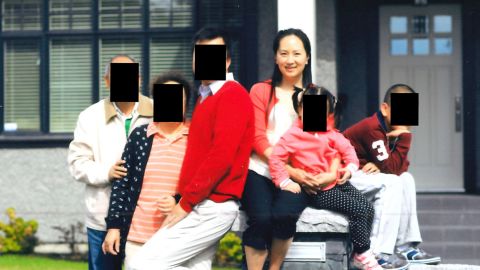 Meng Wanzhou with her husband, her in-laws and her two children, according to court documents. The faces of the other family members have been redacted to protect their identities.