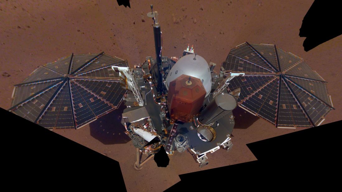 This is NASA InSight's first selfie on Mars. It displays the lander's solar panels and deck. On top of the deck are its science instruments, weather sensor booms and UHF antenna.