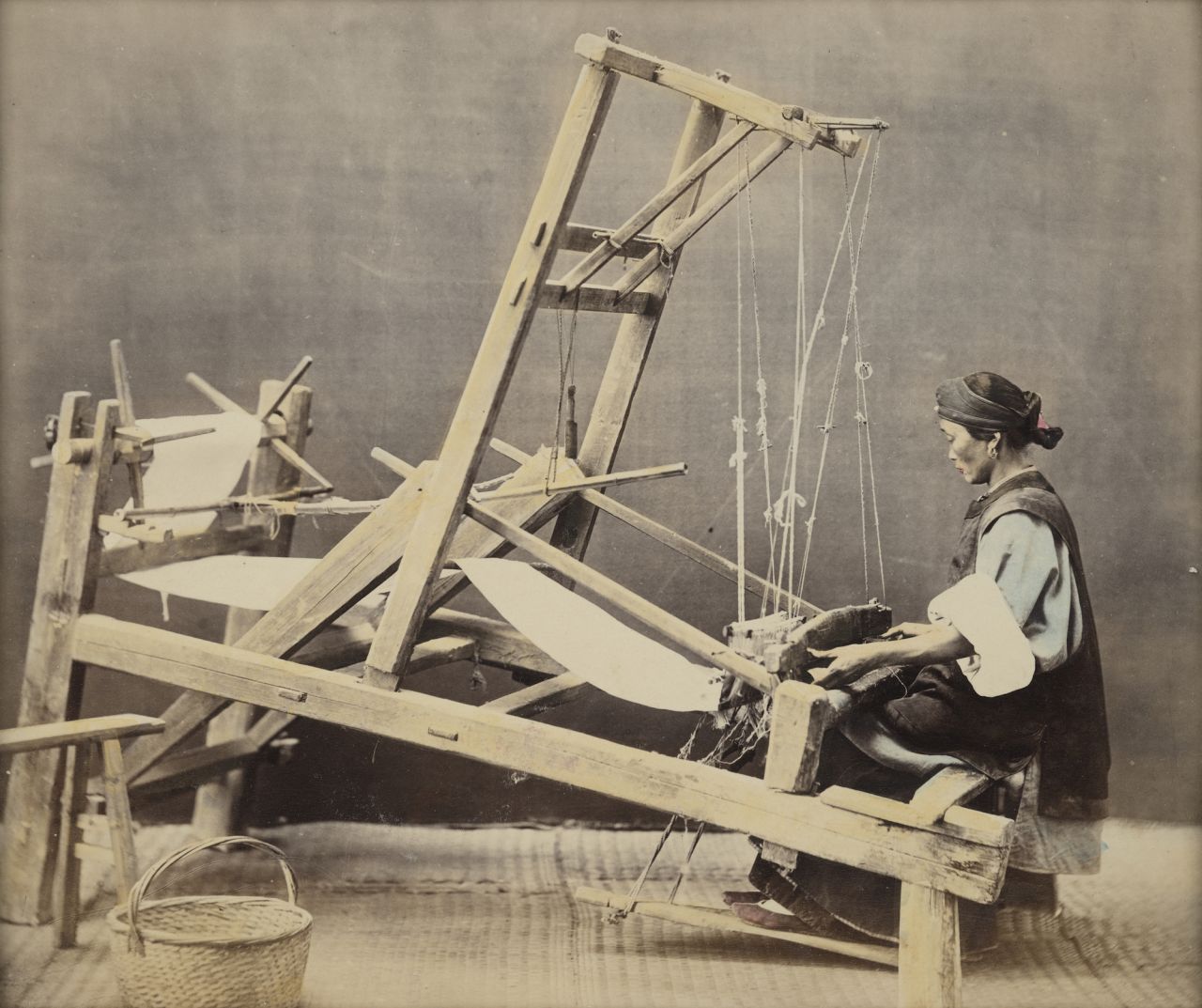 The 15,000-strong photo collection features everyday Chinese tradespeople from the mid-19th century, like this weaver. After being developed, some of the images were hand-colored by painters.