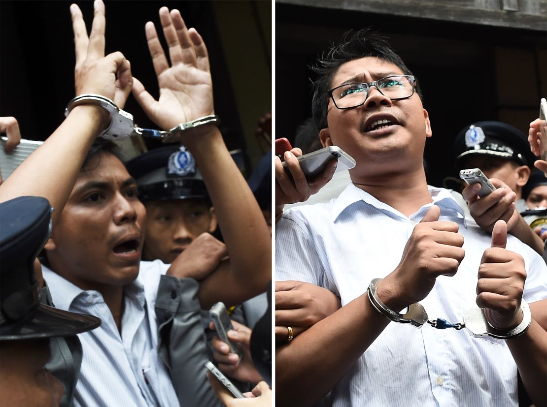 Journalists Kyaw Soe Oo, left, and Wa Lone, right, being escorted by police after their sentencing by a court to jail in Yangon on September 3, 2018.
