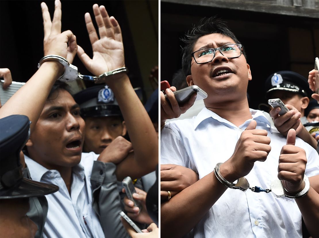 Journalists Kyaw Soe Oo (left) and Wa Lone (right) seen being escorted by police after their sentencing by a court to jail in Yangon on September 3, 2018.