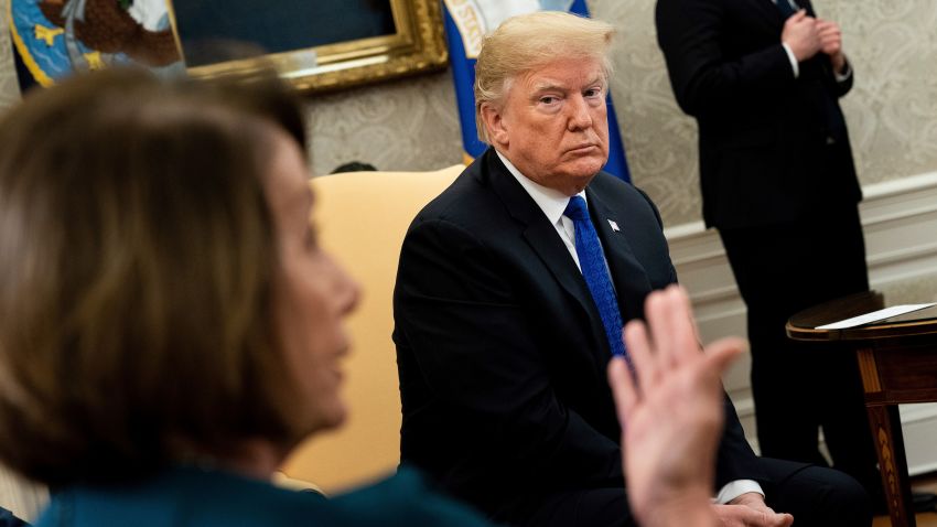 US President Donald Trump (R) listens while presumptive Speaker, House Minority Leader Nancy Pelosi (D-CA) makes a statement to the press before a meeting at the White House December 11, 2018 in Washington, DC. (Photo by Brendan Smialowski / AFP)        (Photo credit should read BRENDAN SMIALOWSKI/AFP/Getty Images)