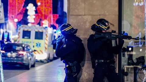 French police officers stand guard near the scene of the shooting on Tuesday.