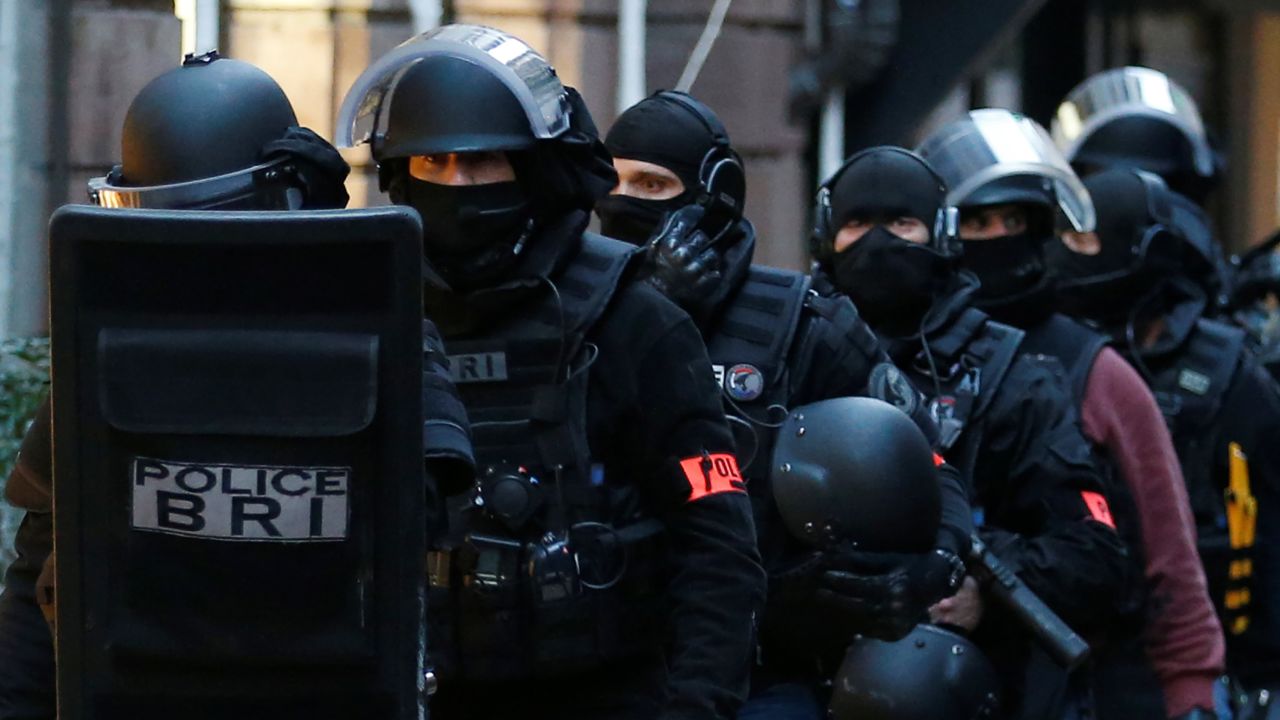 Members of French special police forces of Research and Intervention Brigade (BRI) leave following a police operation the day after a shooting in Strasbourg, France, December 12, 2018.   REUTERS/Vincent Kessler