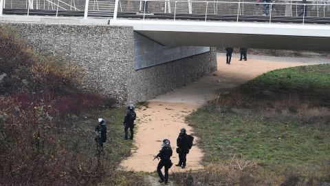 French special forces  search a bank of the River Rhine in Strasbourg on Wednesday as they hunt the gunman.