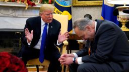 U.S. President Donald Trump speaks with Senate Democratic Leader Chuck Schumer (D-NY) in the Oval Office of the White House in Washington, U.S., December 11, 2018. REUTERS/Kevin Lamarque       TPX IMAGES OF THE DAY