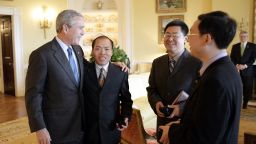 President George W. Bush meets with Chinese Human Rights activists Li Baiguang,  Wang Yi, and Yu Jie in the Yellow Oval Room of the White House in Washington, DC on May 11, 2006. (Photo by Eric Draper/WireImage)