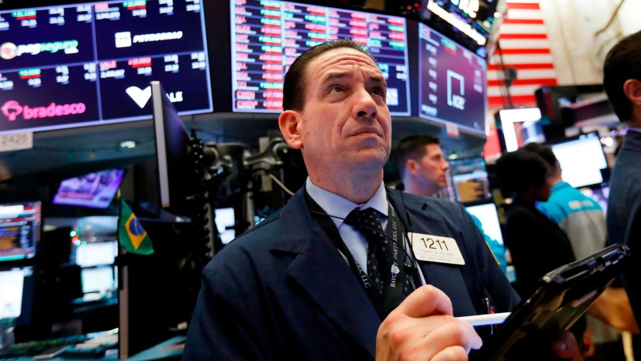 FILE- In this Dec. 6, 2018, file photo trader Tommy Kalikas works on the floor of the New York Stock Exchange. The U.S. stock market opens at 9:30 a.m. EST on Tuesday, Dec. 11. (AP Photo/Richard Drew, File)