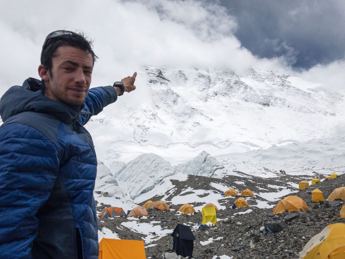 Kilian Jornet points to the summit of Mt. Everest.