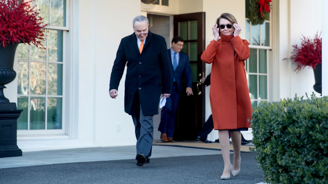 House Minority Leader Nancy Pelosi of Calif., right, and Senate Minority Leader Sen. Chuck Schumer of N.Y., left, walk out of the West Wing to speak to members of the media outside of the White House in Washington, Tuesday, Dec. 11, 2018, following a meeting with President Donald Trump.