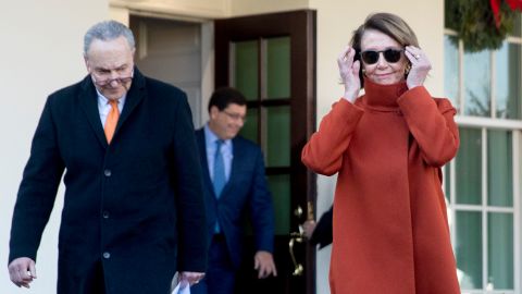 Minority Parliamentary Leader Nancy Pelosi of California, right, and Senate Minority Leader Senator Chuck Schumer of NY, left, walk out of the West Wing to speak to members of the media outside the White House in Washington, Tuesday, December 11, 2018, following a meeting with President Donald Trump.