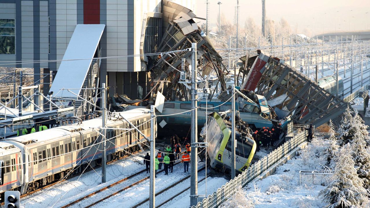 Rescue workers search through wreckage after a high-speed train crash Thursday in Ankara, Turkey.