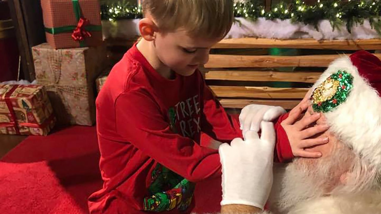 Matthew Wolf is blind and has autism, so the Santa Claus let him feel his face.