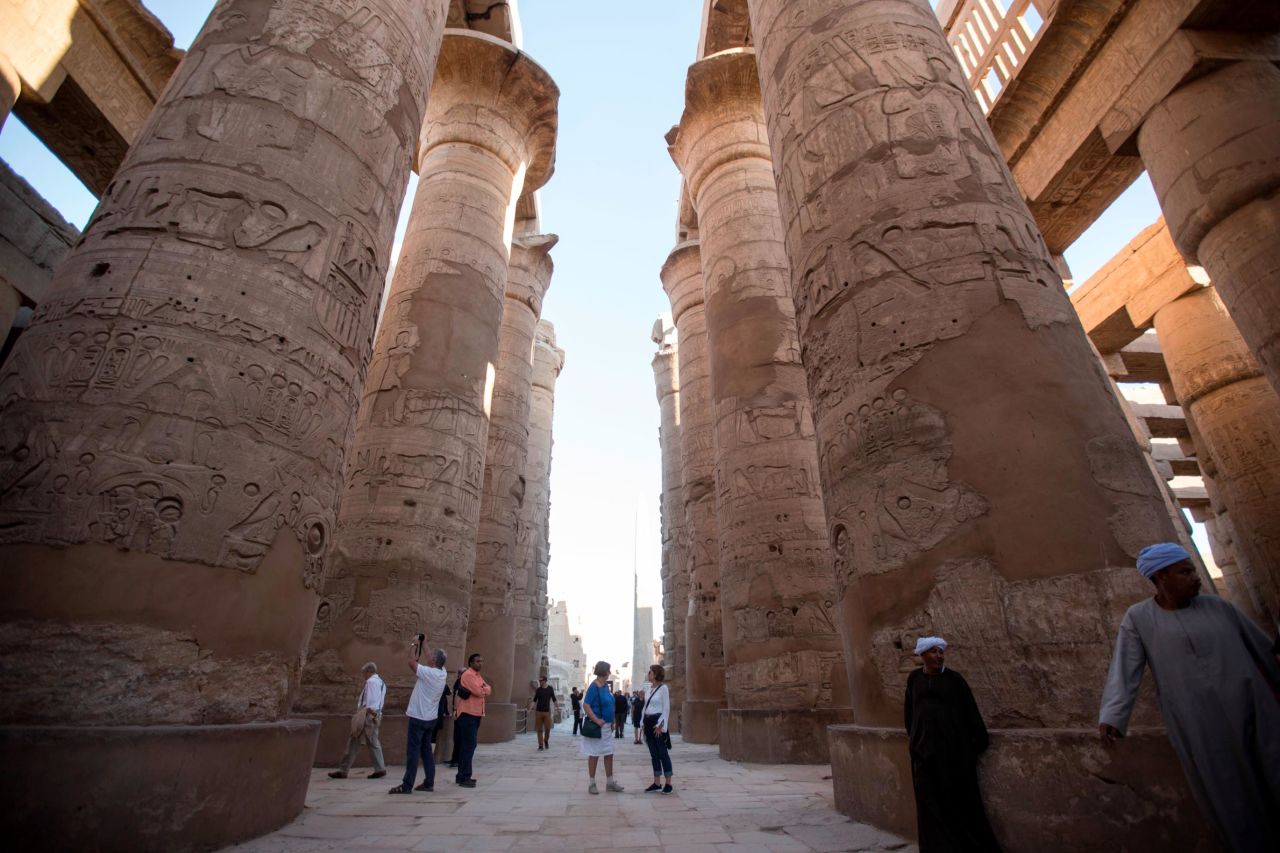 <strong>Karnak Temple: </strong>A hall of columns at the Karnak Temple in Luxor towers over visitors.
