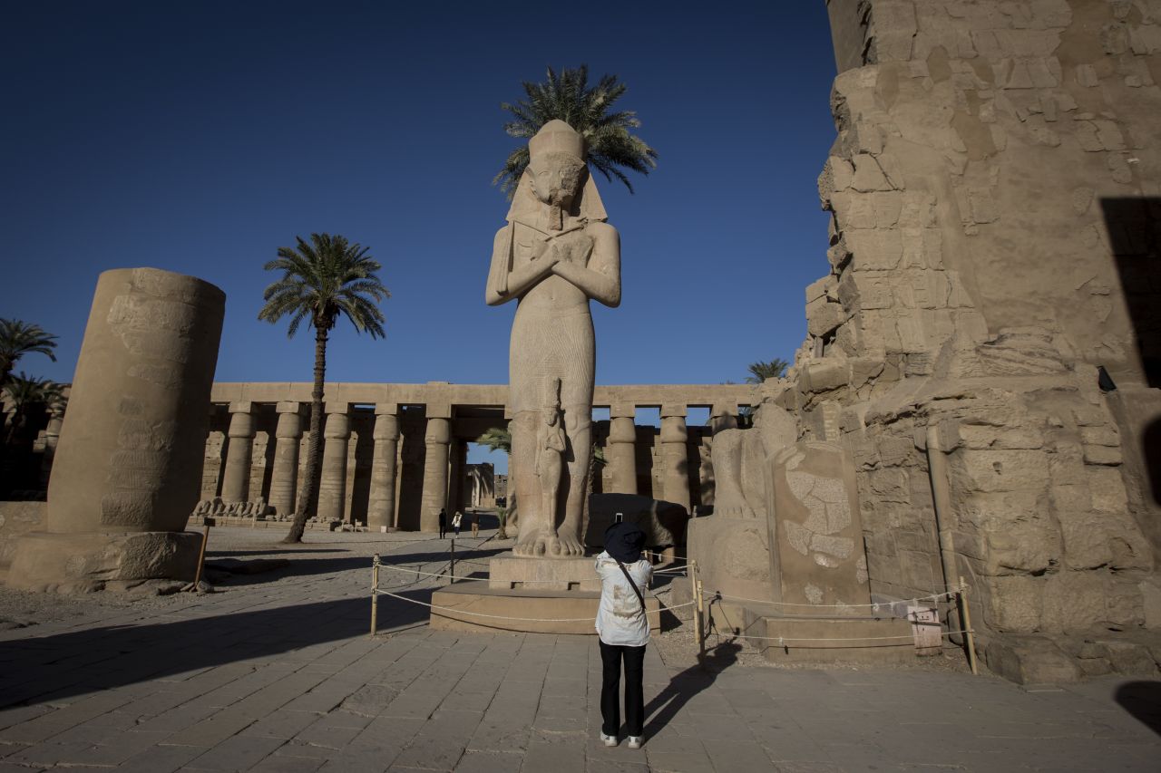 <strong>Karnak Temple:</strong> A Ramses II statue stands at the entrance of Karnak Temple.