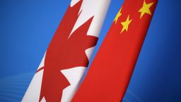 The flags of Canada and China are placed for first China-Canada economic and financial strategy dialogue in Beijing on November 12, 2018. (Photo by JASON LEE / POOL / AFP)        (Photo credit should read JASON LEE/AFP/Getty Images)