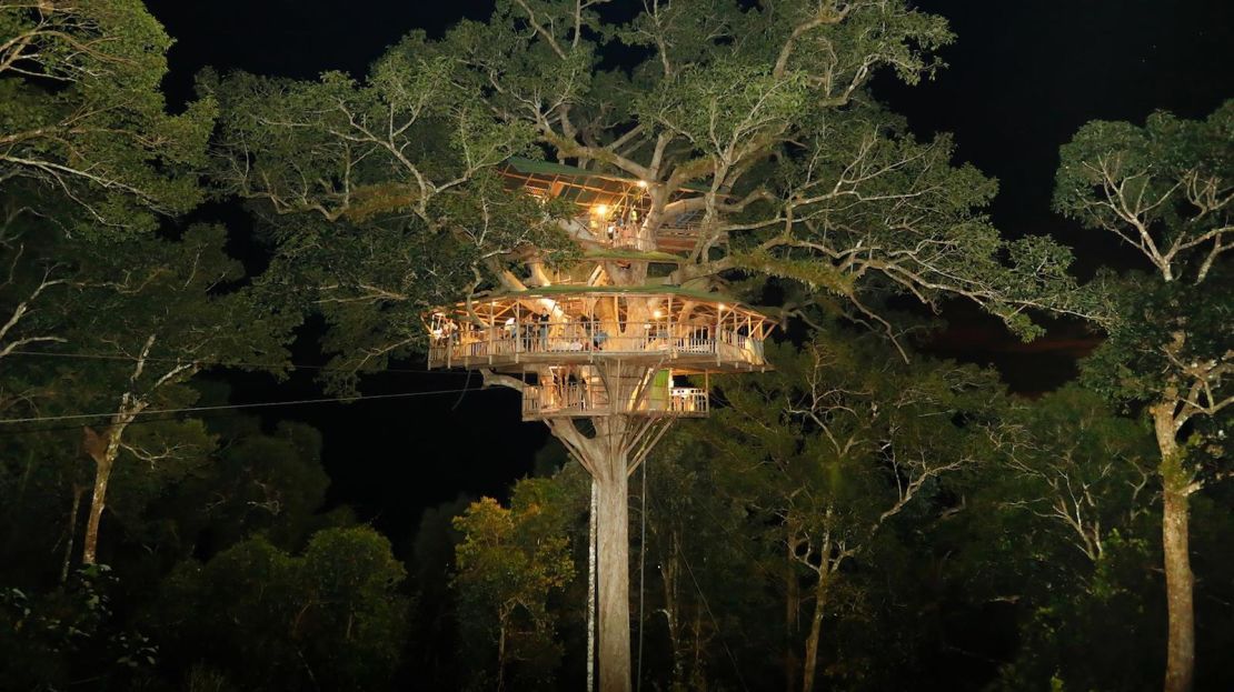 A Gibbon Experience treehouse at night. 