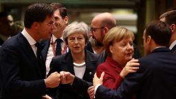 BRUSSELS, BELGIUM - DECEMBER 13: Britain's Prime Minister Theresa May (C) looks on as (L-R) Netherlands' Prime Minister Mark Rutte, Belgian Prime Minister Charles Michel, German Chancellor Angela Merkel and France's President Emmanuel Macron greet each other at the European Council during the start of the two day EU summit on December 13, 2018 in Brussels, Belgium. Mrs May yesterday won a vote of confidence in her leadership among her own MPs 200 to 117. Attending the summit she will attempt to secure greater assurances on the temporary nature of the Irish Backstop, in turn hoping to persuade MPs to vote her Brexit Deal through Parliament in the coming weeks. (Photo by Dan Kitwood/Getty Images)