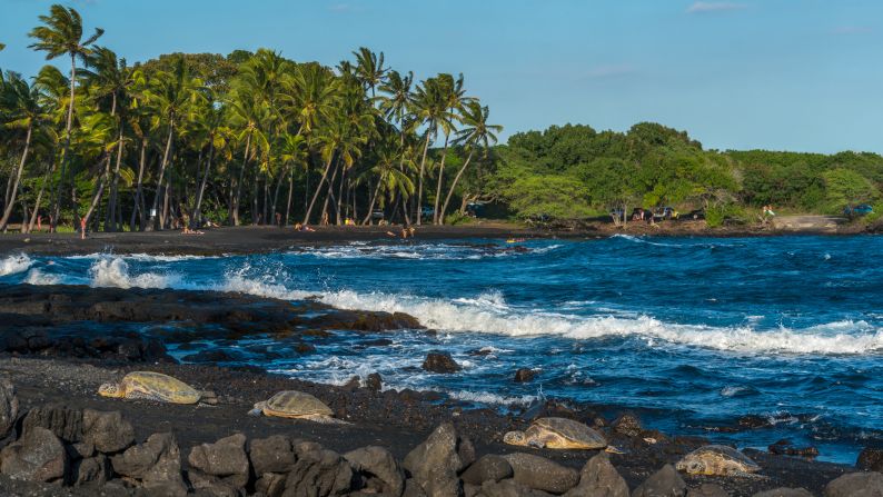 <strong>Black sand and surf: </strong>The charcoal-hued beach boasts plenty of vivid scenery. Cross the beach to find a section of the 175-mile Ala Kahakai Trail.