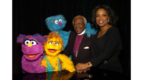Zuzu, Kami and Zikwe from "Takalani Sesame," the South African adaptation of "Sesame Street," with Desmond Tutu and Oprah Winfrey.