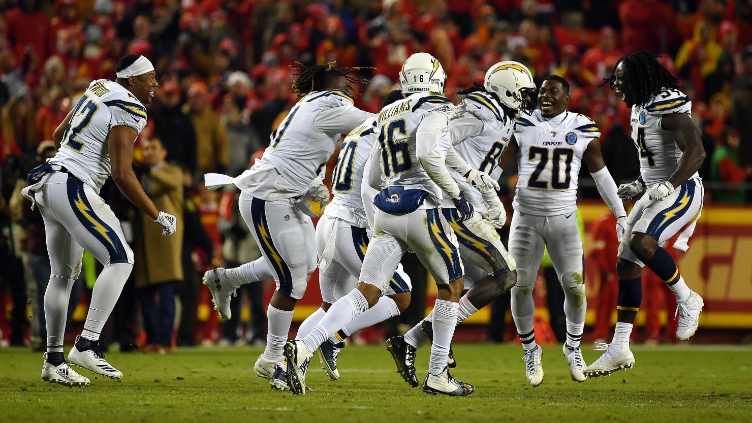 The Chargers celebrate after their comeback win against the Chiefs on Thursday. With the win, the Chargers are back in the playoffs for the first time since the 2013 season.