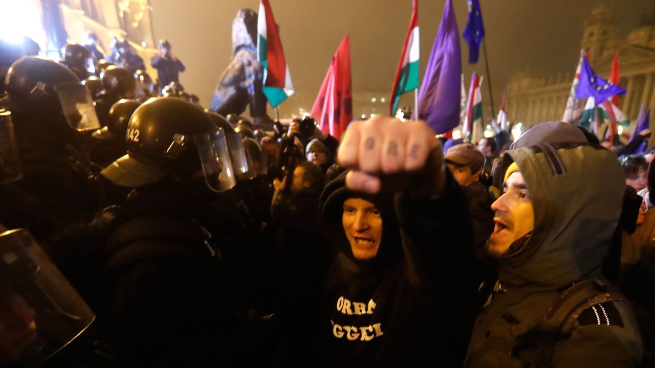 Demonstrators denounce recent legislative measures introduced by the government of Hungarian Prime Minister Viktor Orban outside Parliament on Thursday in Budapest. 