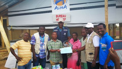 Born October 31, baby Bénédicte is the youngest survivor of Ebola. Seen here with her care givers.