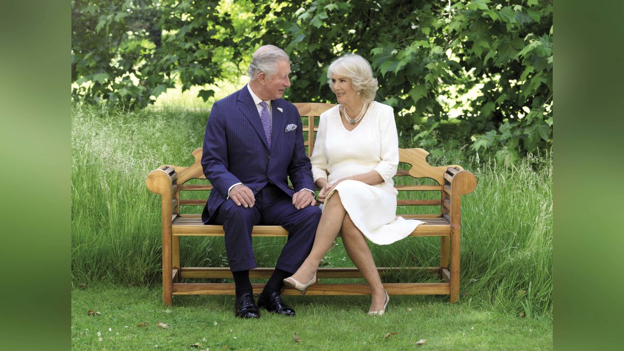 Charles and Camilla chose a verdant scene of the couple on a bench