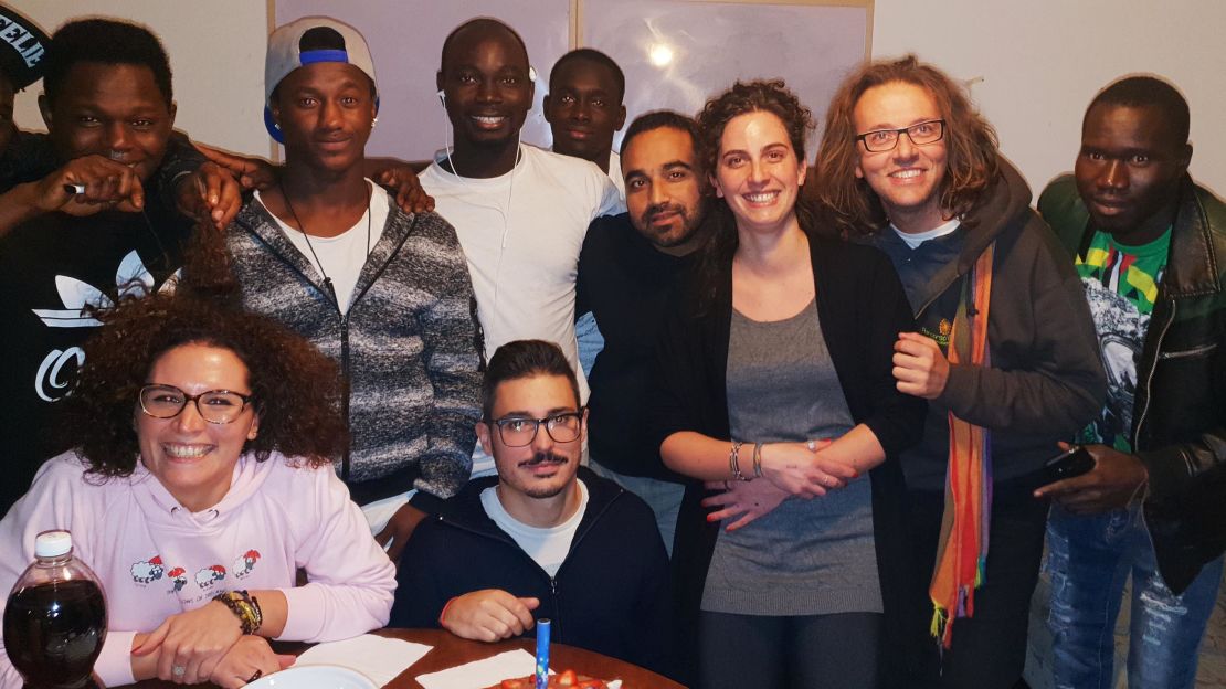 Father Luca Favarin with migrants from his community in Padua, northern Italy