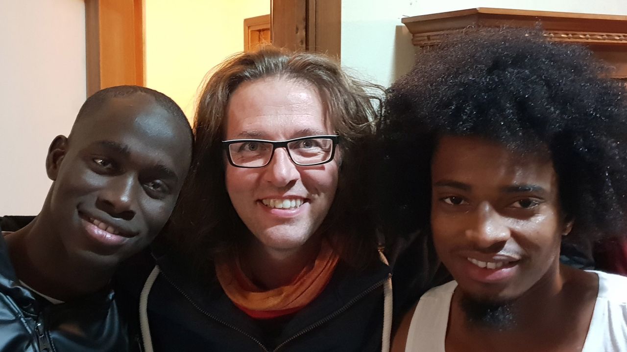 Father Luca Favarin with migrants from his community in Padua, northern Italy