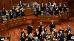Members of the Kosovo Parliament applaud during a parliament session to vote for the Kosovo Army in Pristina on December 14, 2018. - Kosovo on on December 14, 2018 passed laws to build its own army, asserting its statehood in a move that has inflamed tensions with Serbia, who does not recognise the former province's independence.