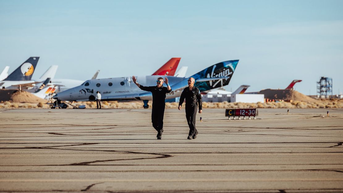 Mark "Forger" Stucky and Rick "CJ" Sturckow emerge from VSS Unity after landing.