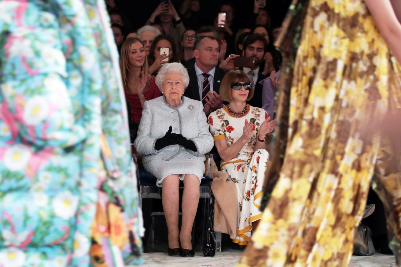 Anna Wintour sits front row with the Queen during London Fashion week in 2018.