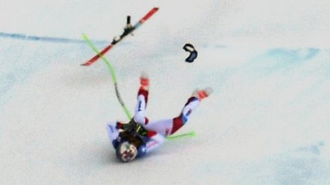 Switzerland's Marc Gisin slid down the Saslong piste on his back and side after a nasty crash just before the 'camel hump' section of the downhill course.  