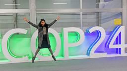 A participant jumps for a picture at the COP24 climate talks in Katowice, Poland, on December 14.