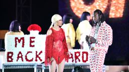 LOS ANGELES, CALIFORNIA - DECEMBER 15: Singer Cardi B (L) is presented a 'Take Me Back' card onstage by her husband Offset (R) during day 2 of the Rolling Loud Festival at Banc of California Stadium on December 15, 2018 in Los Angeles, California. (Photo by Scott Dudelson/Getty Images)