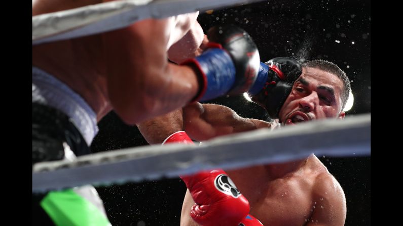Sadam Ali is punched in the face during a welterweight fight against Mauricio Herrera at Madison Square Garden on December 15 in New York City. Ali won the fight by unanimous decision.
