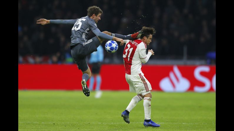 Ajax's Nicolas Tagliafico, right, is fouled by Bayern's Thomas Mueller during the Champions League group E soccer match between Ajax and FC Bayern Munich in Amsterdam, Netherlands on Wednesday, December 12.