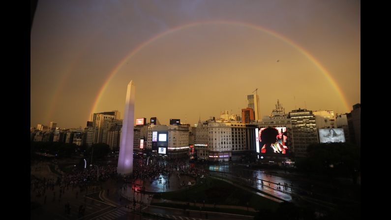 A double rainbow arches over downtown Buenos Aires where River Plate fans celebrate the team's victory over the Boca Juniors on December 9.