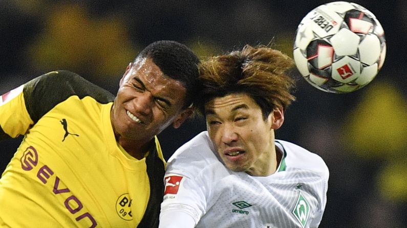 Dortmund's Manuel Akanji, left, and Bremen's Yuya Osako challenge for the ball during a soccer match between Borussia Dortmund and Werder Bremen in Germany on December 15. 