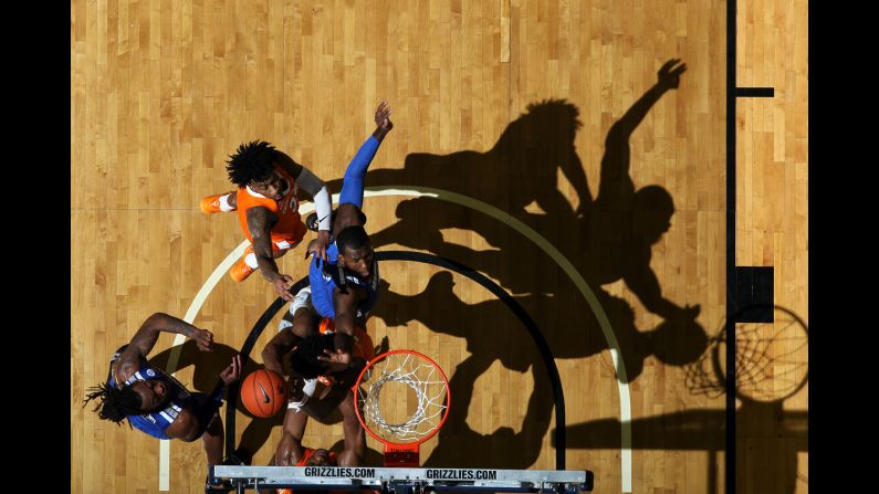 Raynere Thornton of the Memphis Tigers jumps for a rebound against Jordan Bowden of the Tennessee Volunteers on December 15 at FedExForum in Memphis, Tennessee. The Volunteers defeated the Tigers 102-92. 
