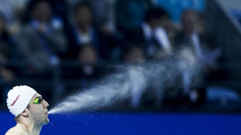 Cameron van der Burgh of South Africa blows water out of his mouth during the Men's 50m Breaststroke Semifinals on day 5 of the 14th FINA World Swimming Championships in Hangzhou, China on December 15.
