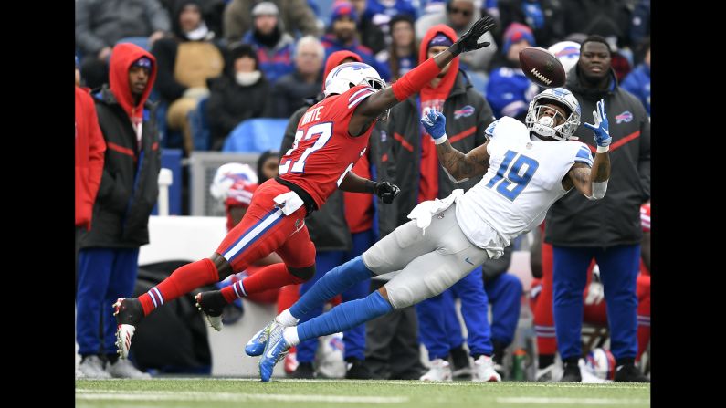 Detroit Lions wide receiver Kenny Golladay catches a pass while defended by Buffalo Bills cornerback Tre'Davious White during the first half of their game on December 16 in Orchard Park, New York.